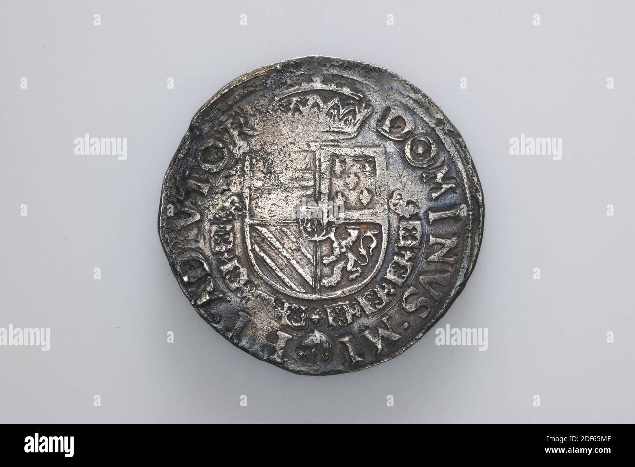 coin swap, Anonymous, 1569, minted, General: 3.8 x 0.2cm 38 x 2mm, Weight: 28.1g, weapon sign, cross, Silver coin of King Philips II, minted in 1569. On the obverse is a central Burgundian cross depicted. The year 1569 is written on both sides. Around it is the circular PHS D G HISP REX [worn] C HOL. On the reverse is a crowned coat of arms with the chain of the Golden Fleece around it, with the sheepskin hanging at the bottom. It is surrounded by the circular DOMINUS MI HI ACIVIOR, 1926 Stock Photo