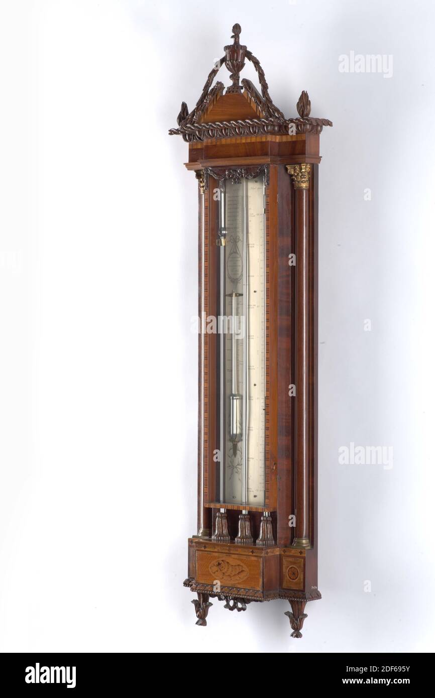 Dominicus Sala, c. 1820, satinwood, glass, oak, mahogany, brass, General: 130 × 40 × 11cm 1300 × 400 × 110mm, Dutch counter-baking barometer with thermometer. The cabinet is made of oak, veneered with mahogany and satin walnut. The center tube and the counter tube have a scale in English thumbs and in Rhenish thumbs, combined with a 36 scale. The thermometer has a scale in Réaumur and Fahrenheit. The shell plates are made of silver-plated brass. The cupboard jumps forward as risky, on both sides on the back wall two semicircular brass columns with corinthian capitals. The cantilevered crest Stock Photo