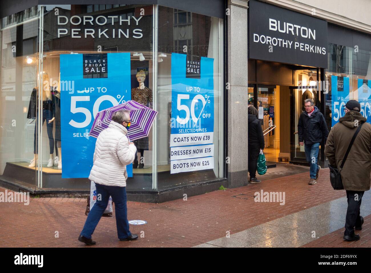 High Street, Southend on Sea, Essex, UK. 3rd Dec, 2020. Despite the sleety cold and wet weather shoppers are out in the High Street in Southend on Sea, including visiting the troubled Arcadia Group owned Burton, Dorothy Perkins stores. The window display is advertising Black Friday sale. The High Street has already lost many of its shops Stock Photo
