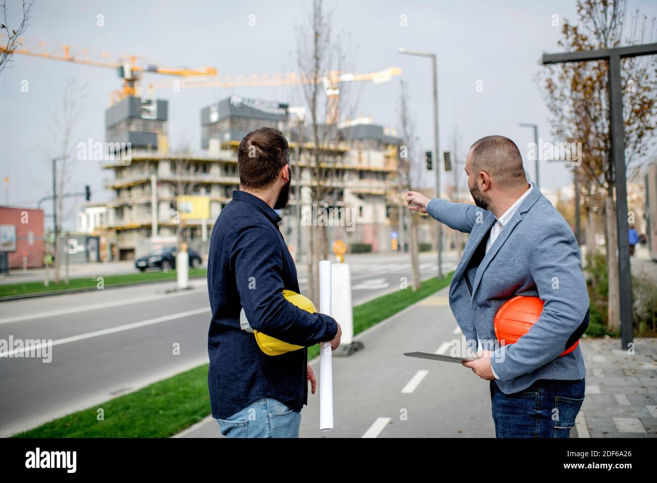 Two architects having work meeting at construction site Stock Photo