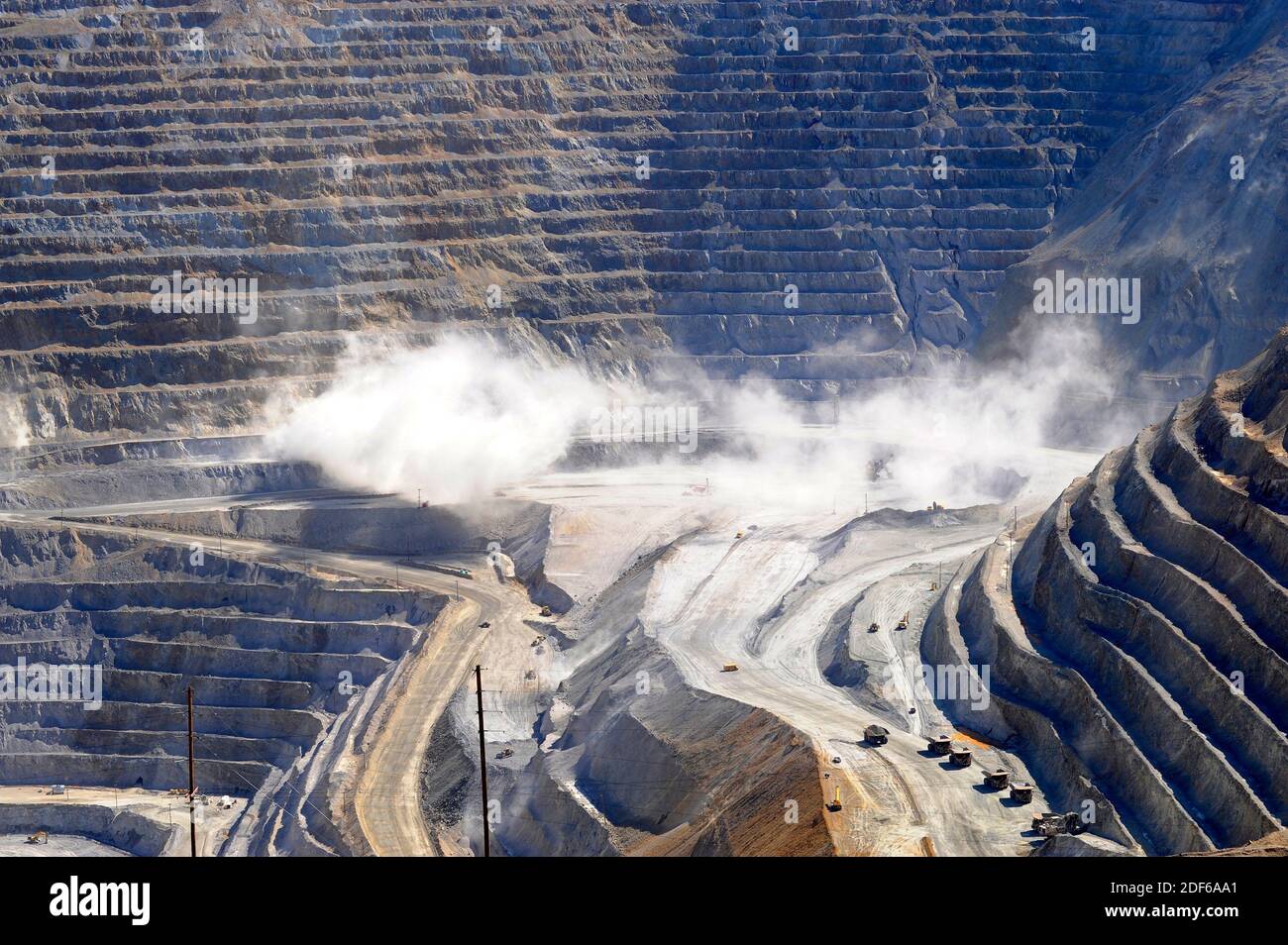 Bingham Canyon Mine at the time of the controlled explosion. Bingham Canyon known as Kennecott Mine is a open-pit copper mine. Oquirrh Mountains, Stock Photo