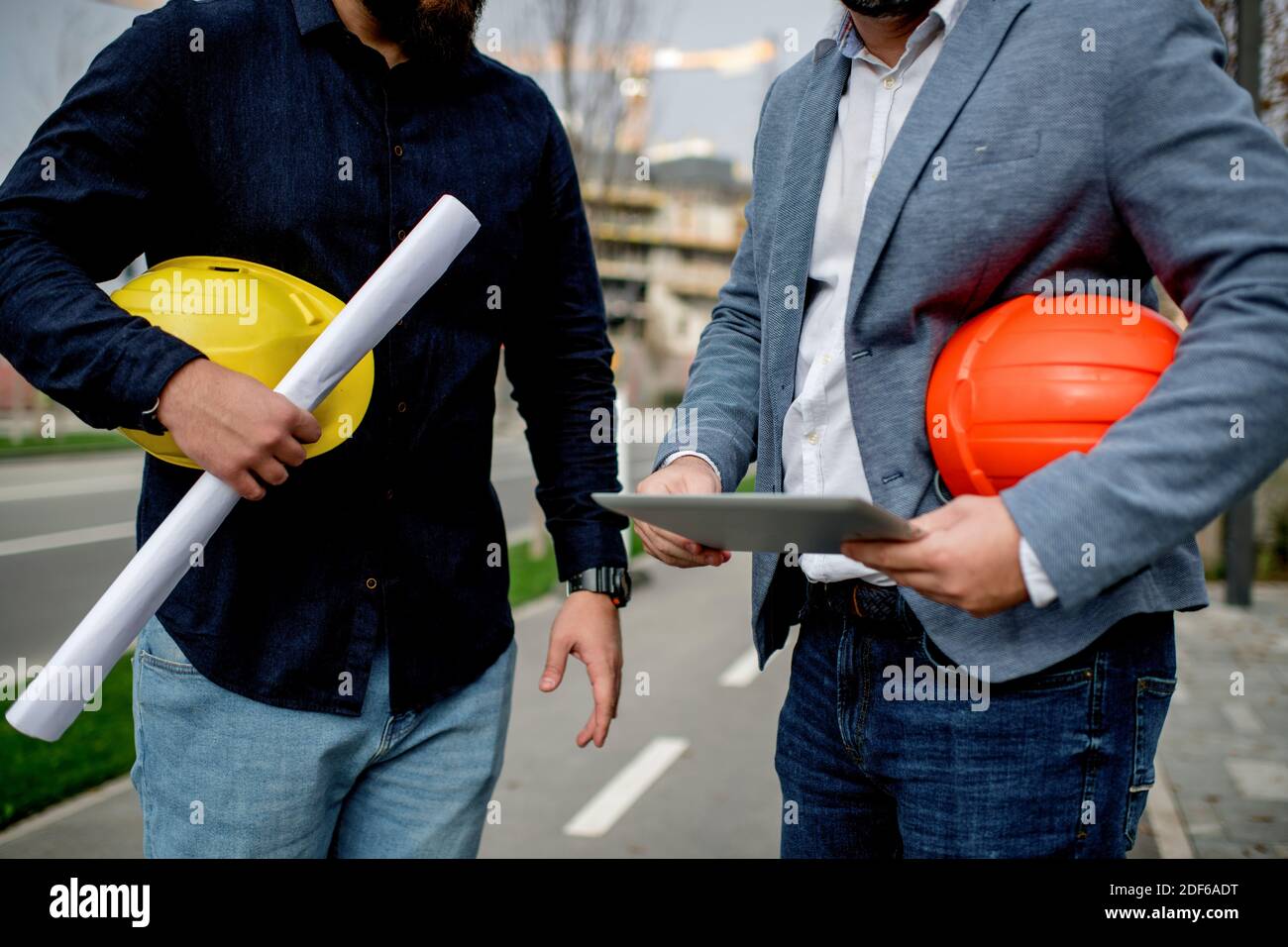 Two architects having work meeting at construction site Stock Photo