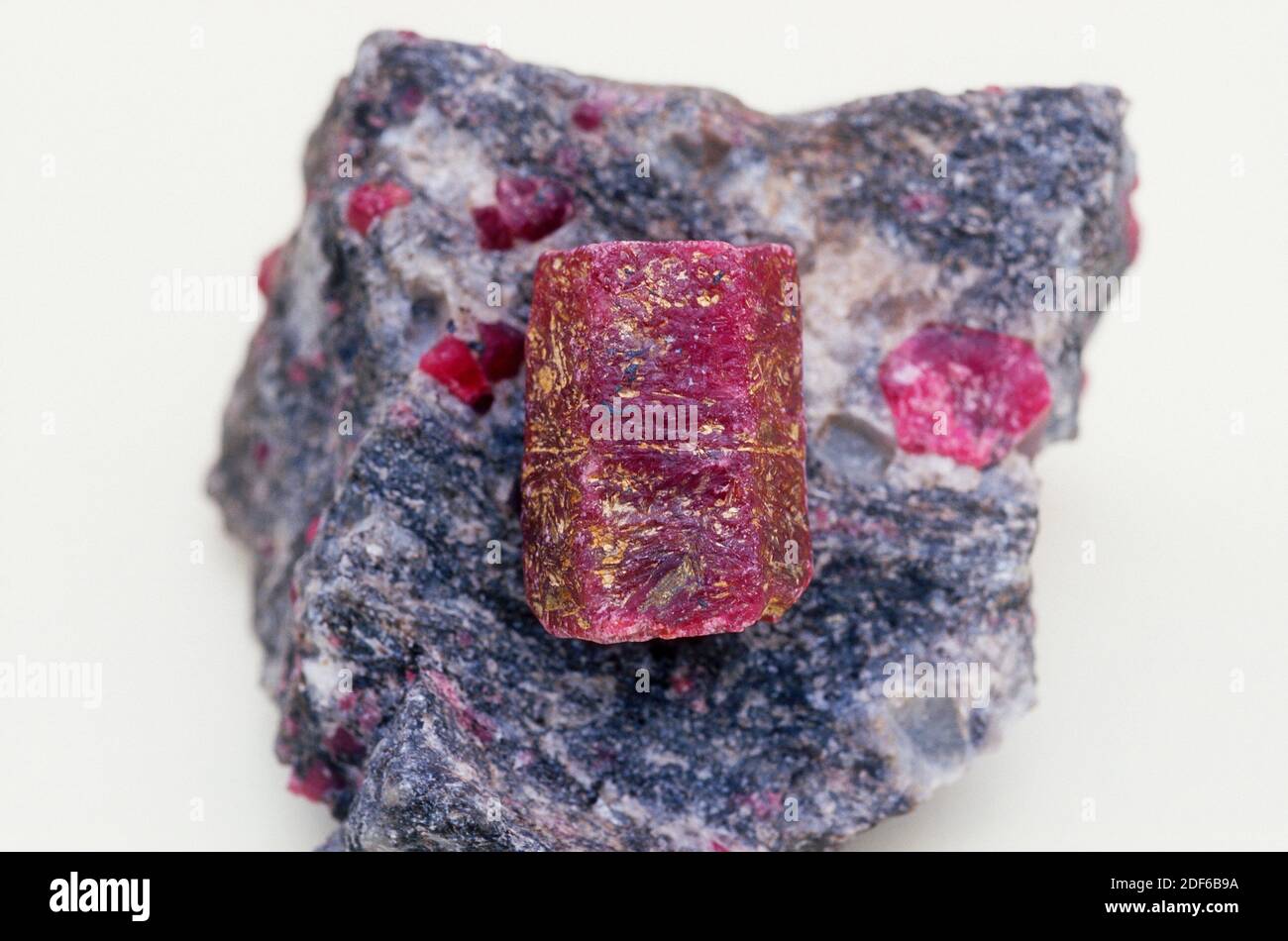 Red corundum crystal or ruby. Ruby is an aluminum oxide with traces of chromium, iron, titanium