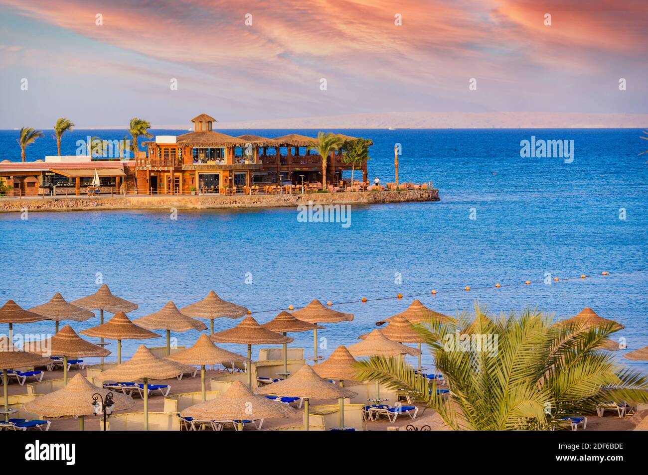 Relaxing at paradise beach - Chaise lounge and parasols - travel