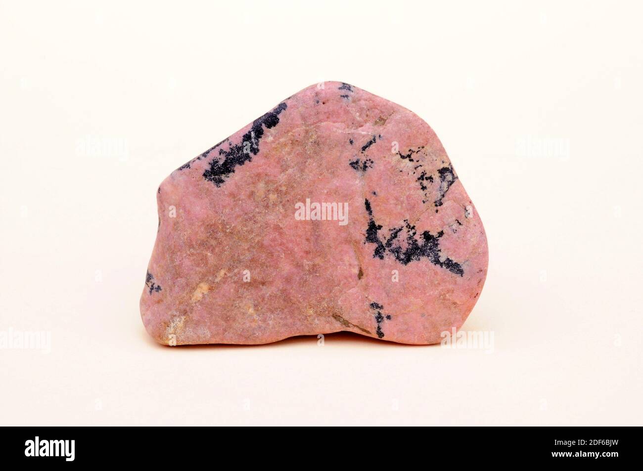 Rhodonite with pyrolusite. Rhodonite is a pink mineral composed of manganese silicate