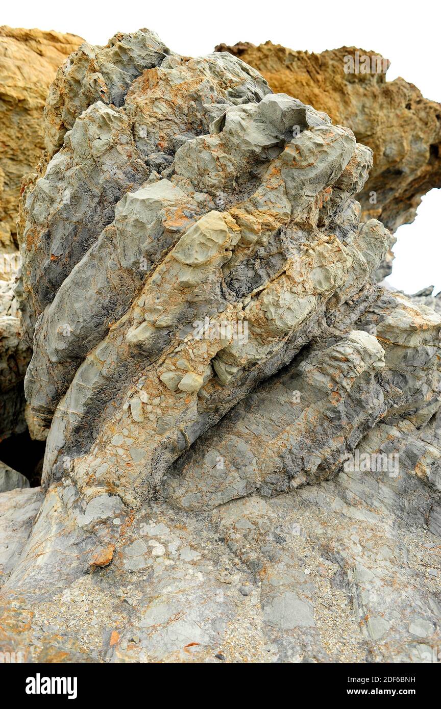 Fault breccia is a breccia formed for the grinding action of two blocks fault that rub. This photo was taken in Cabo Creus, Girona, Catalonia, Spain. Stock Photo