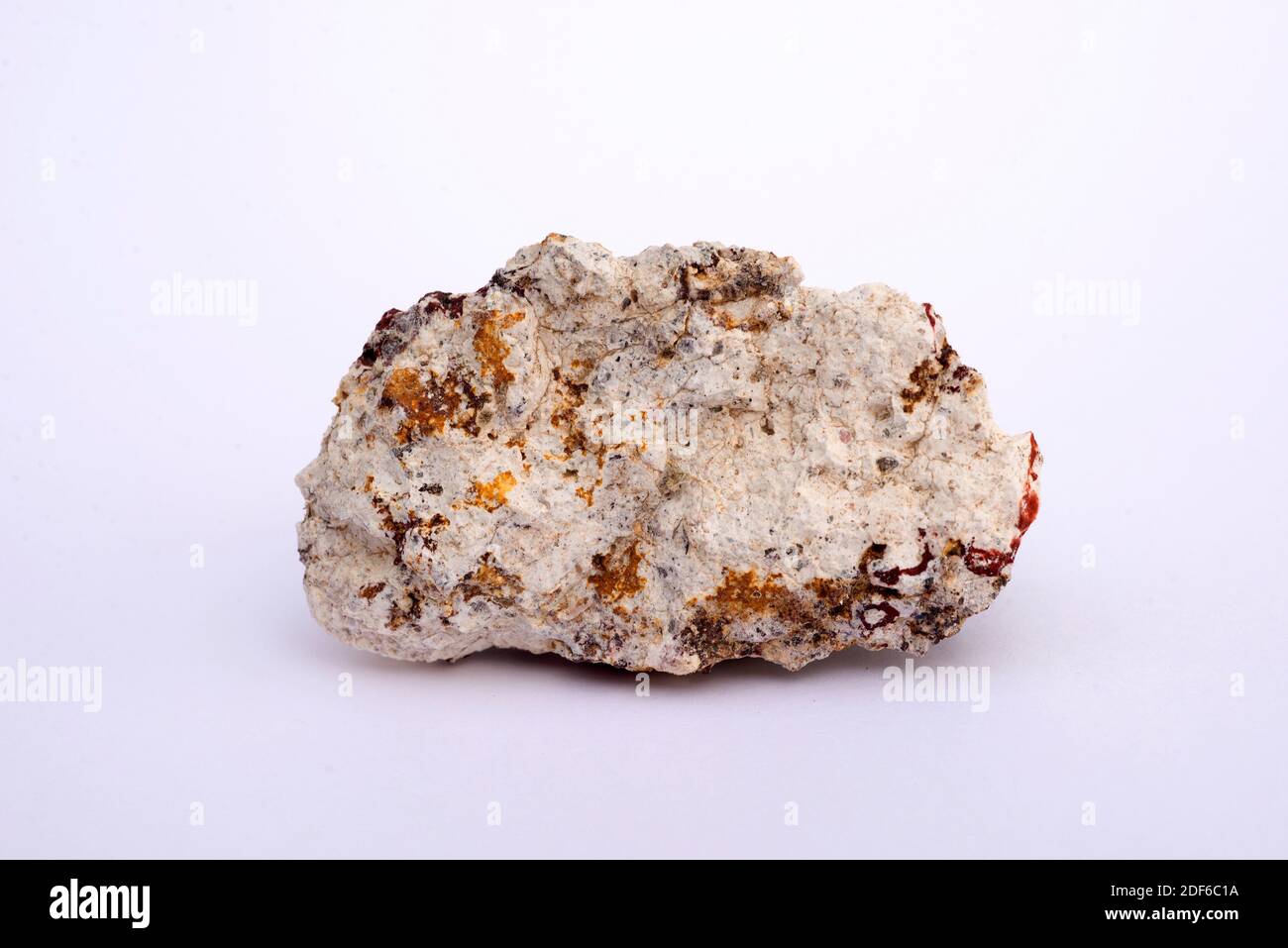 Ignimbrite is a volcanic rock formed from a lithified deposit of pyroclastic flow. This sample comes from Cabo de Gata, Almeria, Andalusia, Spain. Stock Photo