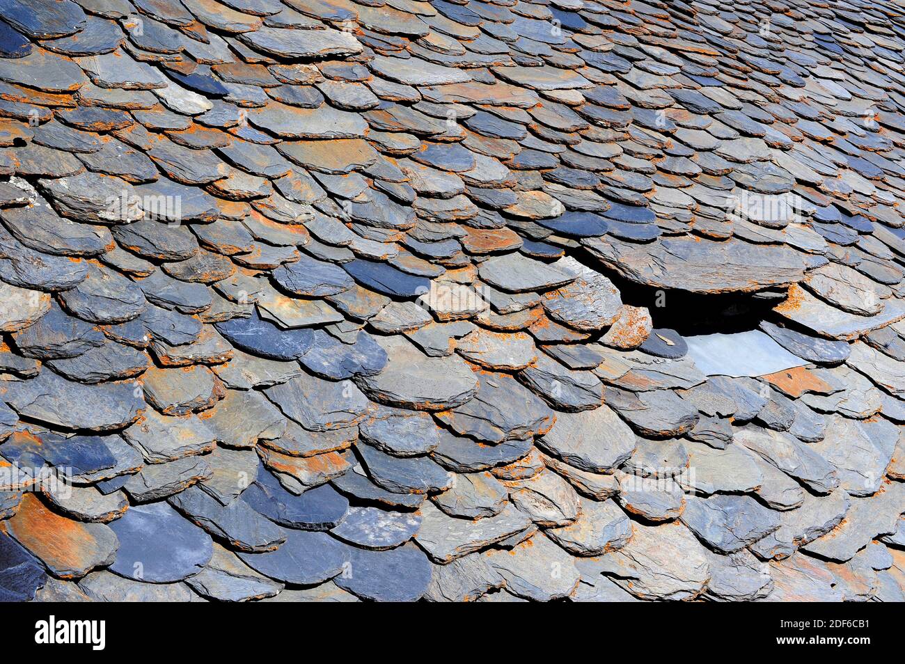 Roof shale. Shale is a fissile compacted sedimentary rock. This photo was taken in Pallars Sobira, Lleida, Catalonia, Spain. Stock Photo