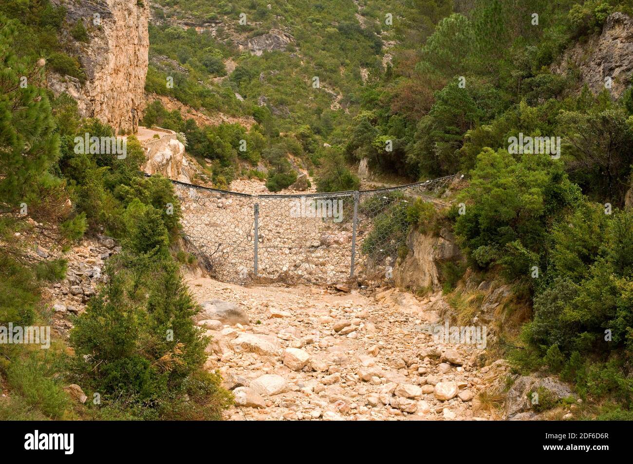Risk, flood protection in a torrent in Barranc de Lloret, Tarragona, Catalonia, Spain. Stock Photo