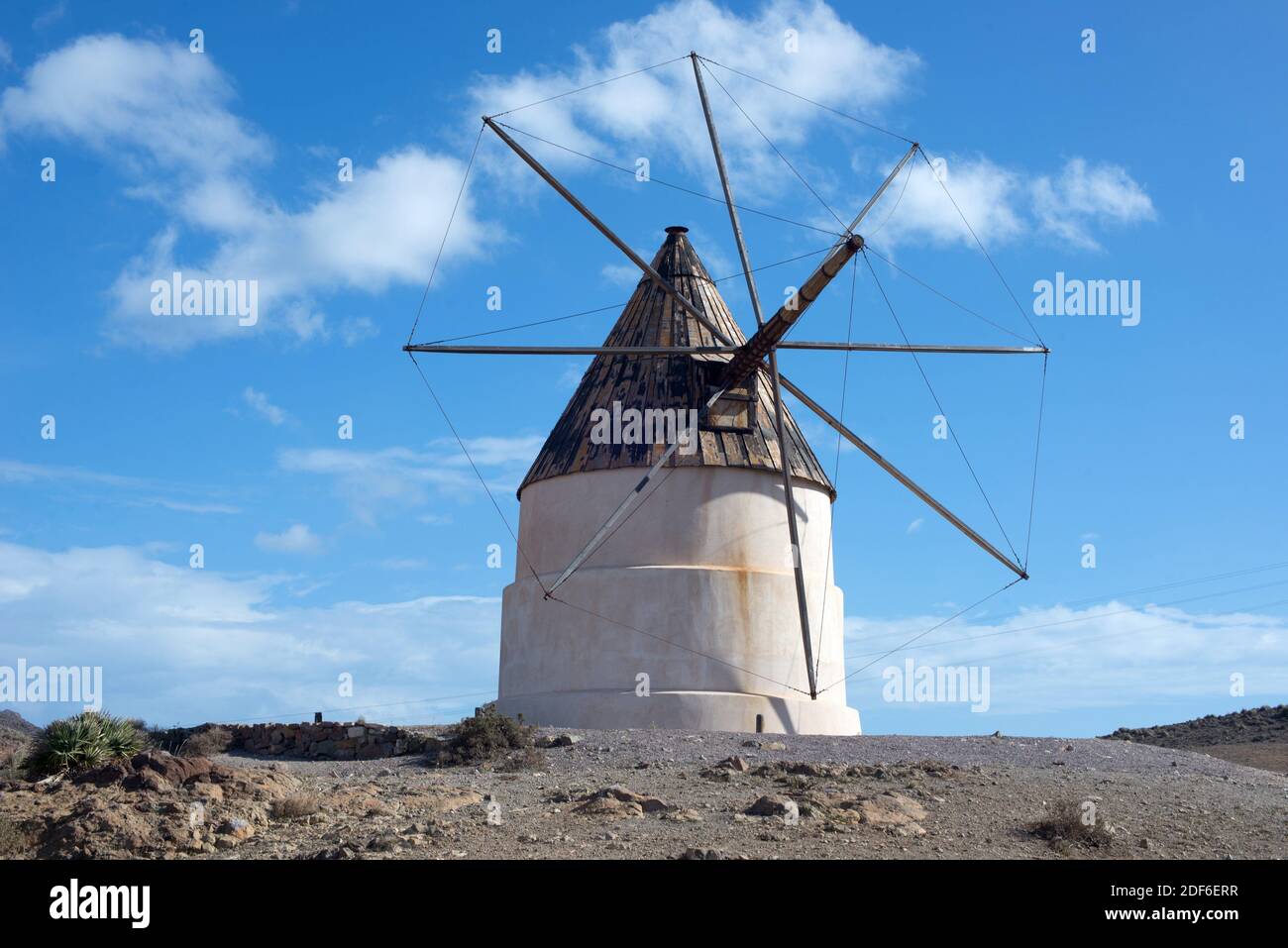 Traditional windmill in Cerro del Ave Maria, Cabo de gata-Nijar Natural Park, Almeria province, Andalucia, Spain. Stock Photo
