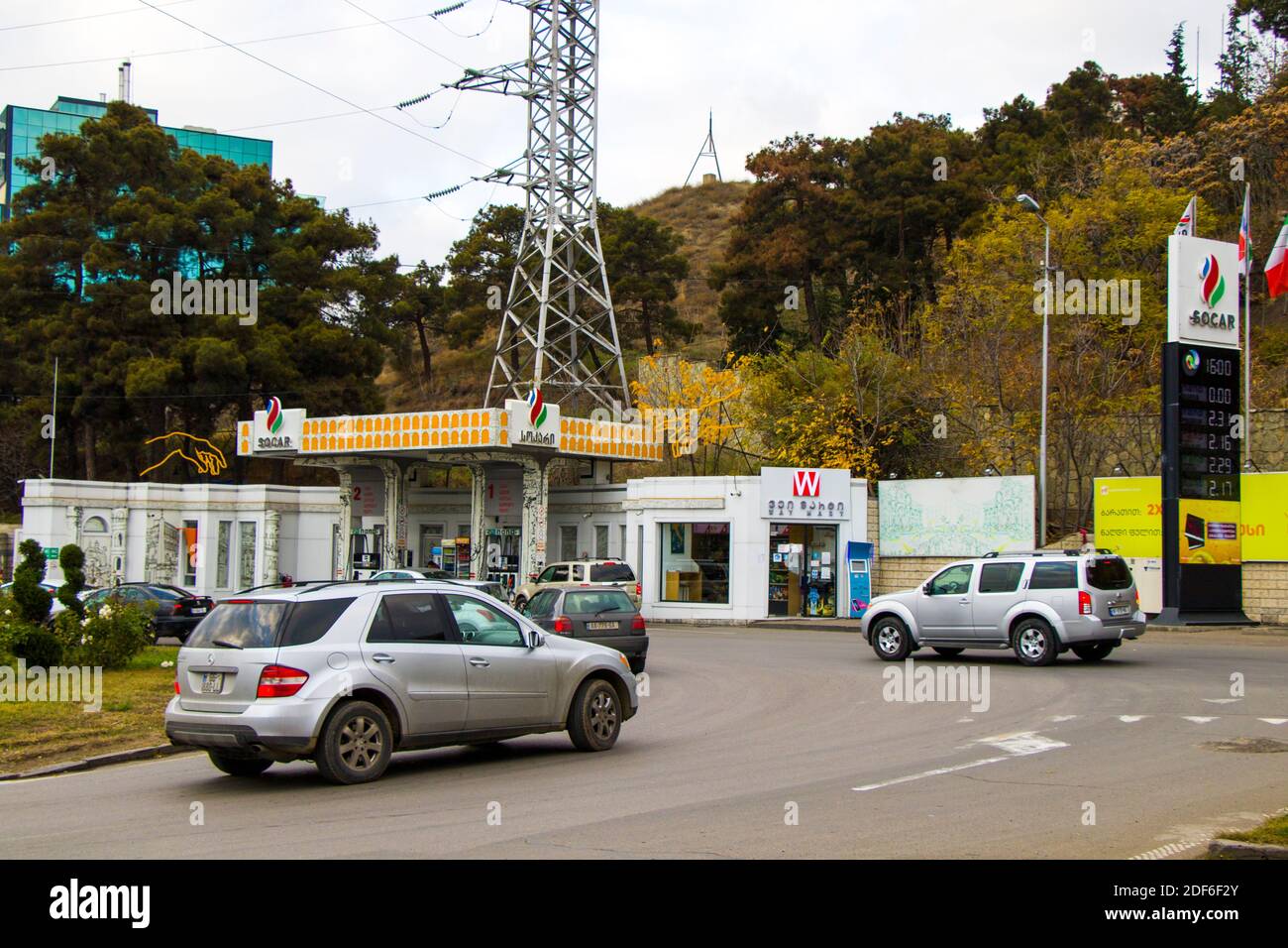 Tbilisi, Georgia - December 1, 2020: Socar petrol station, garage and market. Cars and autos on the road. Stock Photo