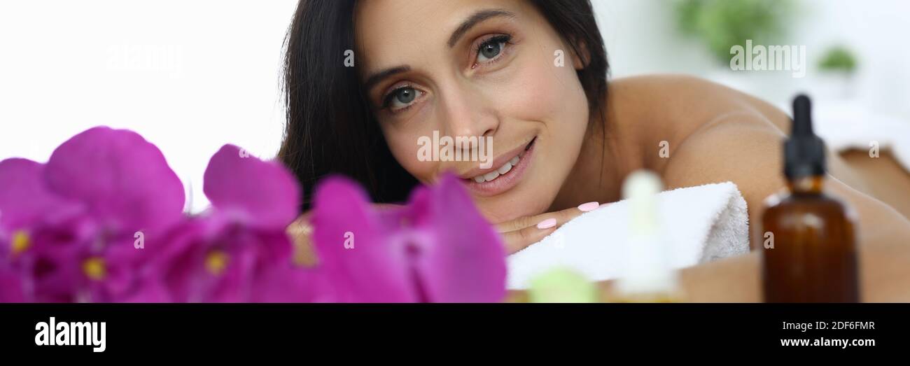 Portrait of brunette woman relaxing in spa center Stock Photo - Alamy