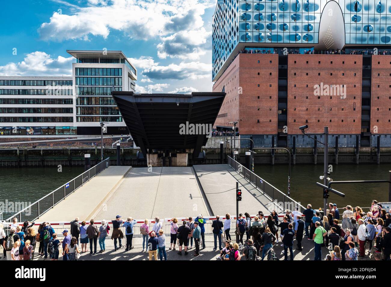 Hamburg, Germany - August 21, 2019: Facade of the Elbphilharmonie, Elbe Philharmonic Hall, and opened Mahatma Gandhi Bridge with people waiting in Haf Stock Photo