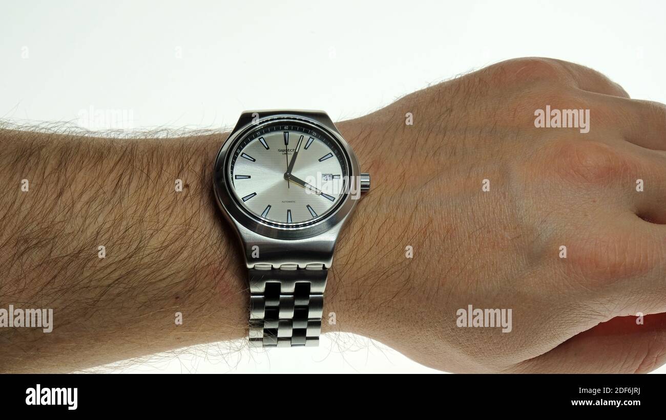 Swatch watch on the man hand Stock Photo