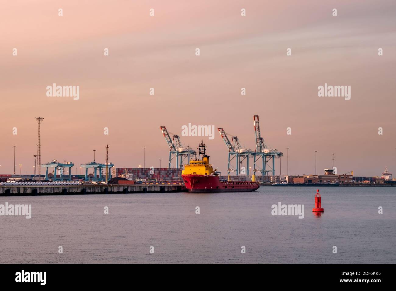 Container terminal in the port of Zeebrugge at sunset. View from the viewing platform near the monument 'Vissers Stock Photo