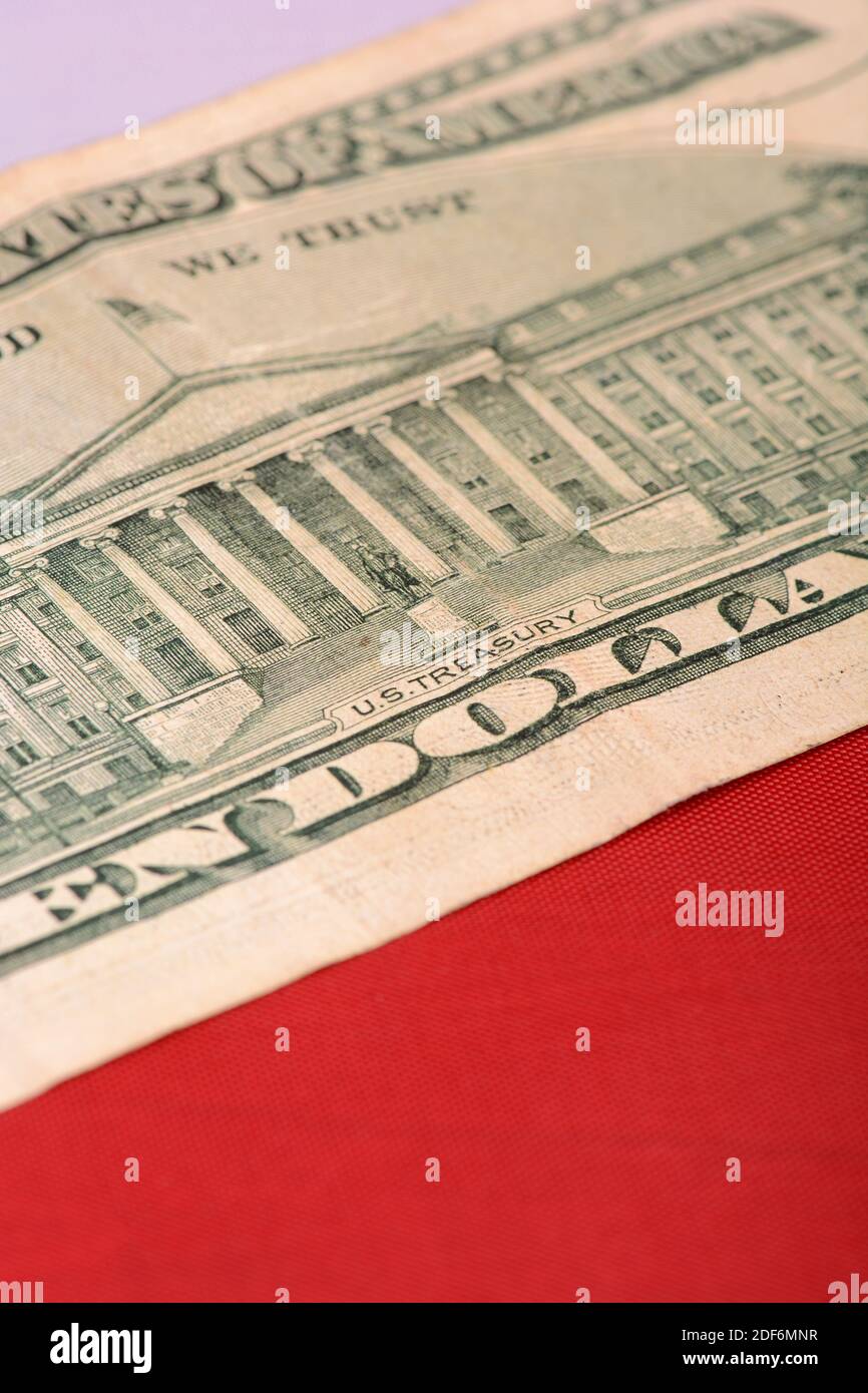 ten dollar bill in front of the American flag Stock Photo