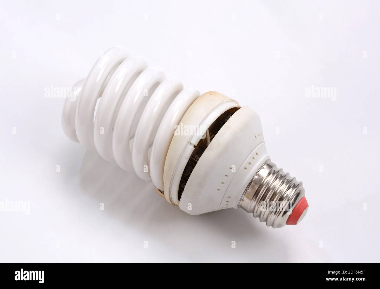 Fluorescent Lightbulbs. One compact old fluorescent light bulb over on white background. Stock Photo