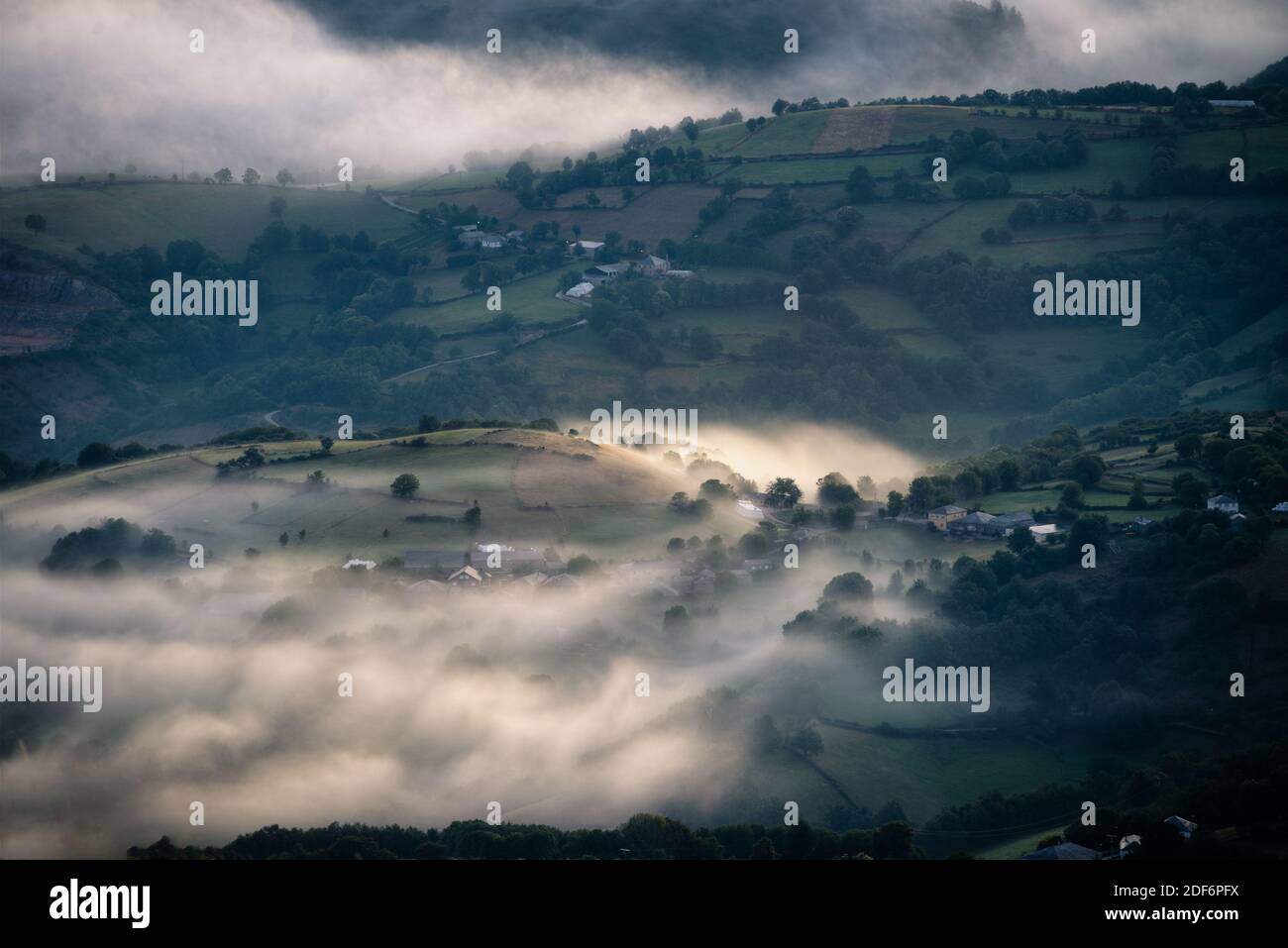 Stagnant fogs in the lowlands between hills in rural Galicia Stock Photo