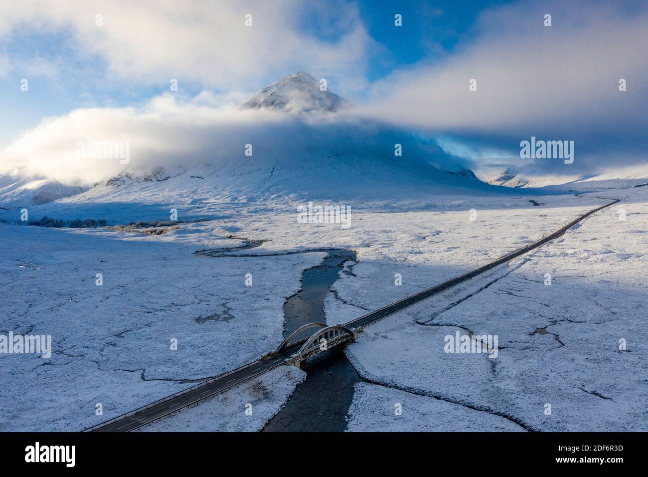 Glen Coe, Scotland, UK. 3 December 2020. A cold front has brought the first snowfall to the Scottish Highlands. Rannoch Moor and Glen Coe are covered in several inches of snow. Bright sunshine throughout the day created beautiful winter landscapes.  Pictured; Buachaille Etive Mor  shrouded in mist.  Iain Masterton/Alamy Live News Stock Photo