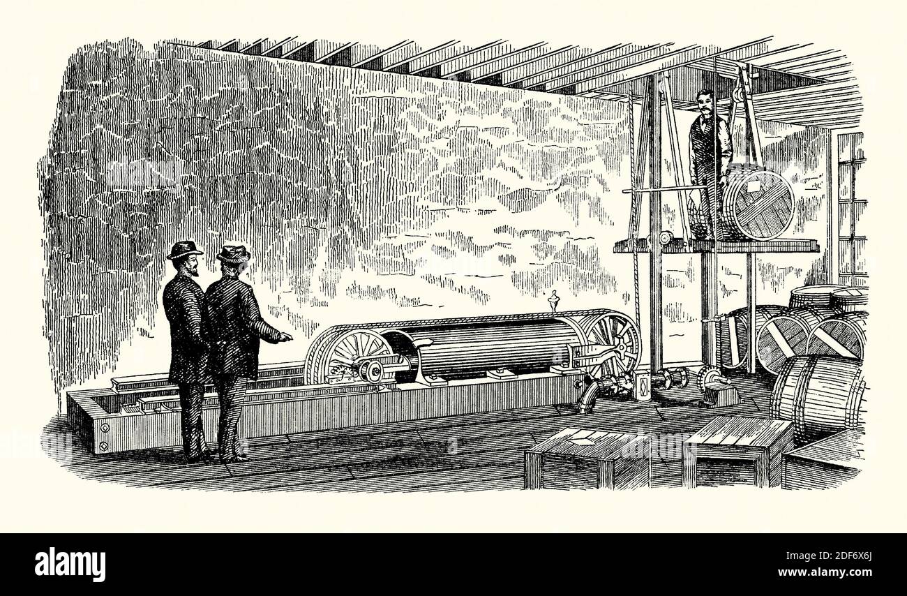 An old engraving of a rope elevator (lift or hoist) together with a hydraulic rope clutch used in a factory or warehouse. It is from a Victorian mechanical engineering book of the 1880s. The steam-powered clutch device operated a piston cylinder with jaws each side of the drum. The elevator could be activated by a chord or automatically to stop the platform. The platform has safety ratchets which instantly lock the elevator platform to the side guides if a rope failure occurs. Elisha Grave Otis demonstrated the first safety elevator at the 1854 New York Exposition. Stock Photo