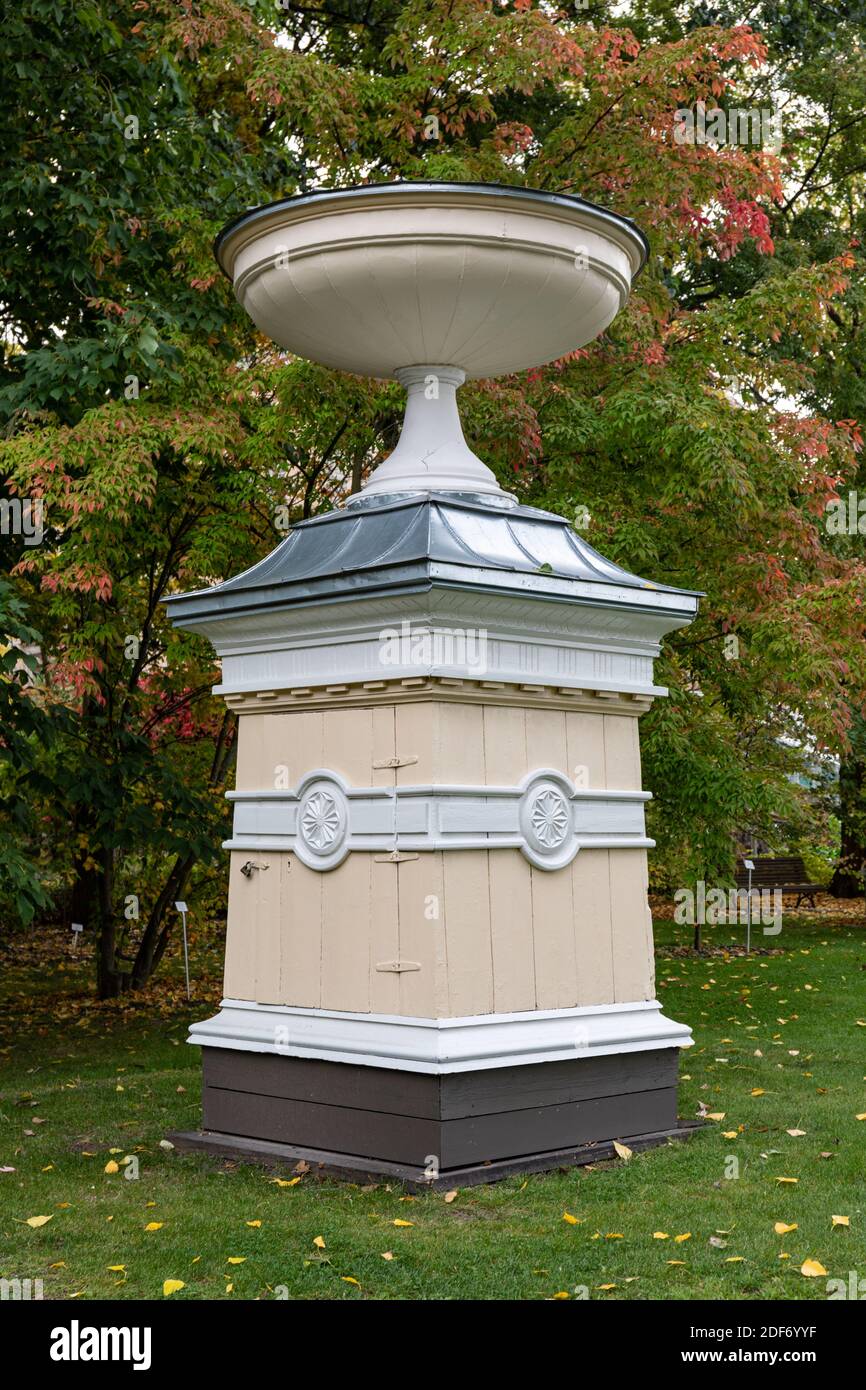 Old empire style wooden well lid in Kaisaniemi Botanical Garden in Helsinki, Finland Stock Photo