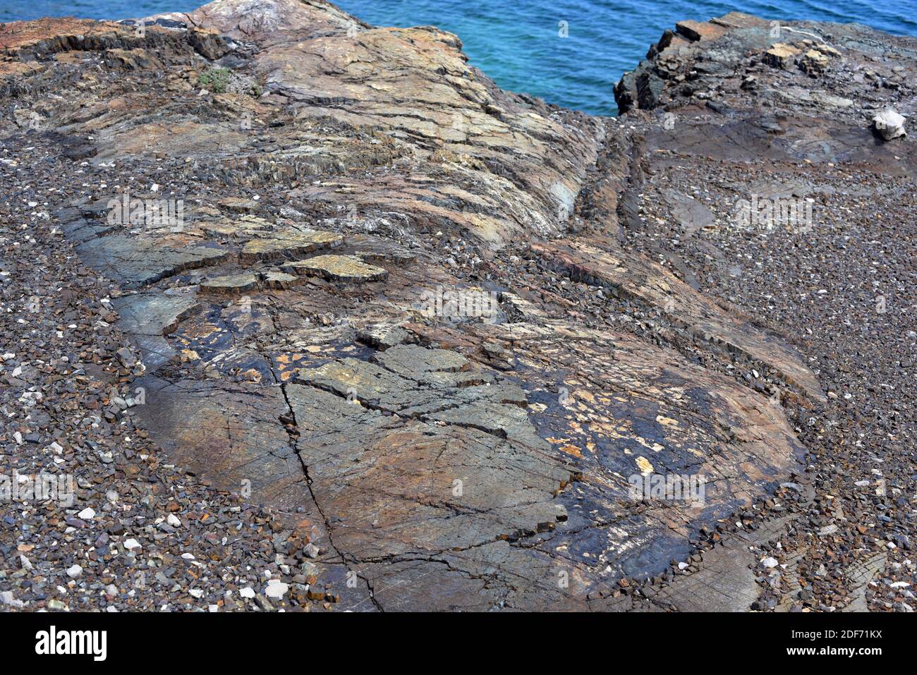 Fault plane is the fracture surface of fault. This photo was taken in Cala Mica, Menorca Island, Balearic Islands, Spain. Stock Photo