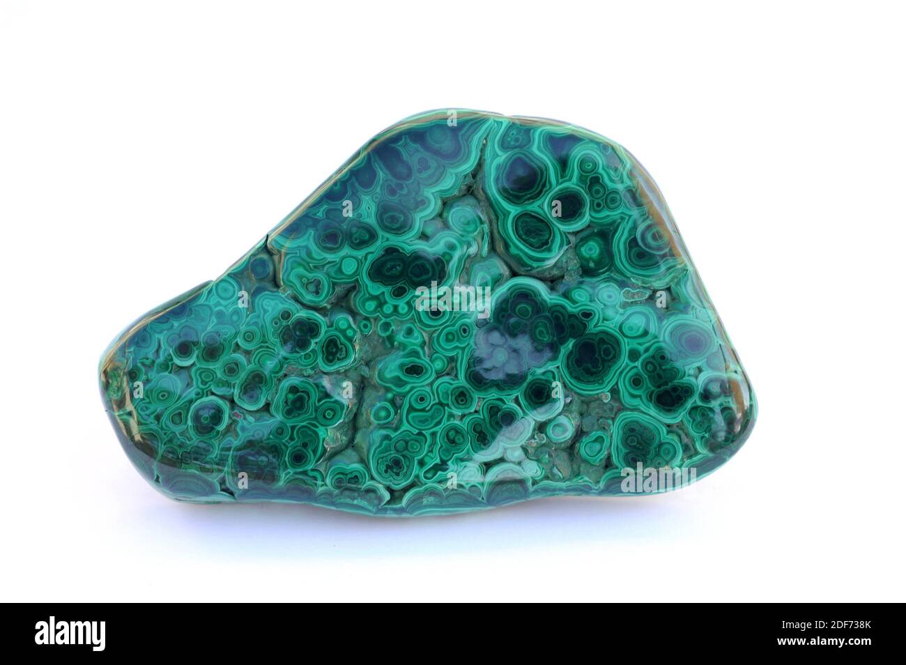 Malachite is a copper carbonate mineral used as copper souce, gemstone and pigment. Polished sample. Stock Photo