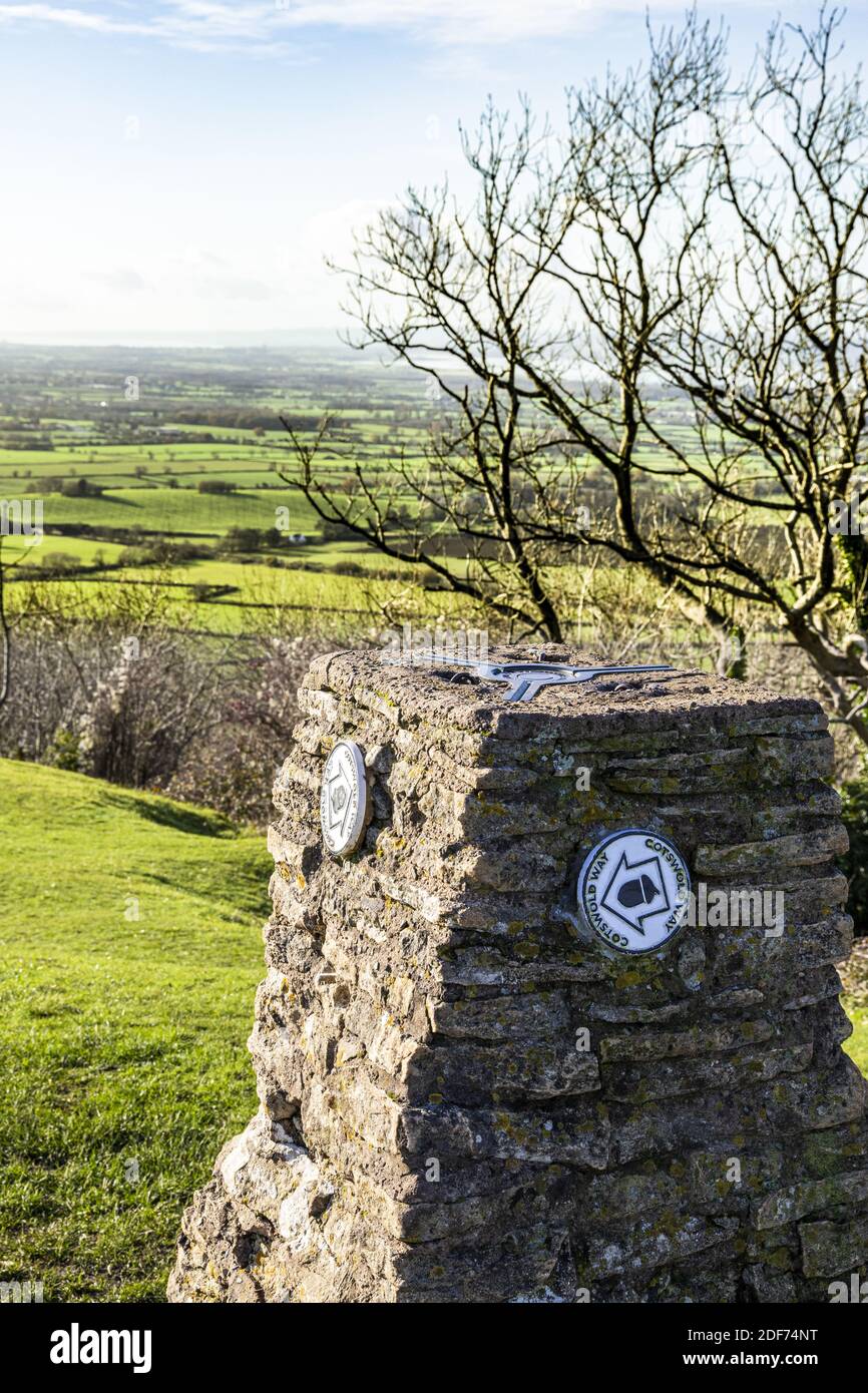 The topograph with Cotswold Way waymarks on the Cotswold viewpoint of Haresfield Beacon with the Severn Vale in the background, Gloucestershire UK Stock Photo