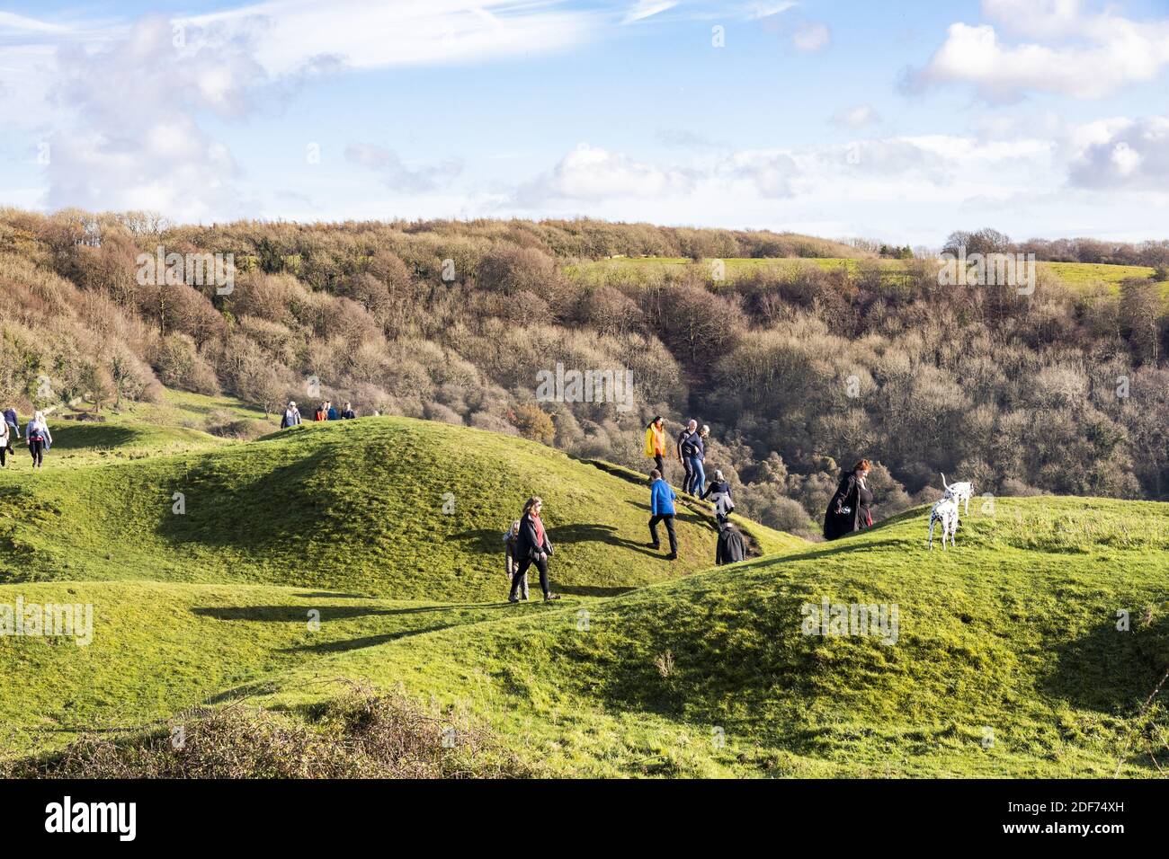 People enjoying Sunday morning sunshine at the Cotswold viewpoint of Haresfield Beacon, Gloucestershire UK Stock Photo
