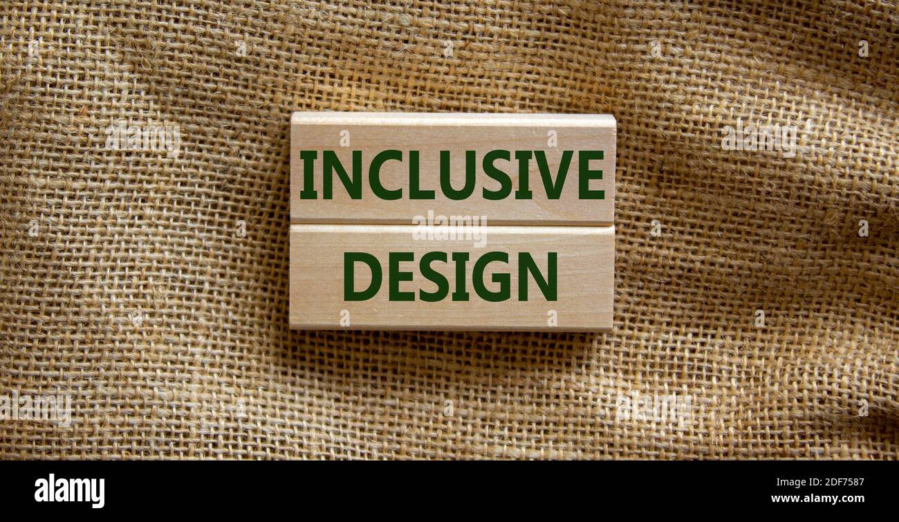 Inclusive design symbol. Wooden blocks form the words 'inclusive design' on beautiful canvas background. Inclusive design Concept. Copy space. Stock Photo