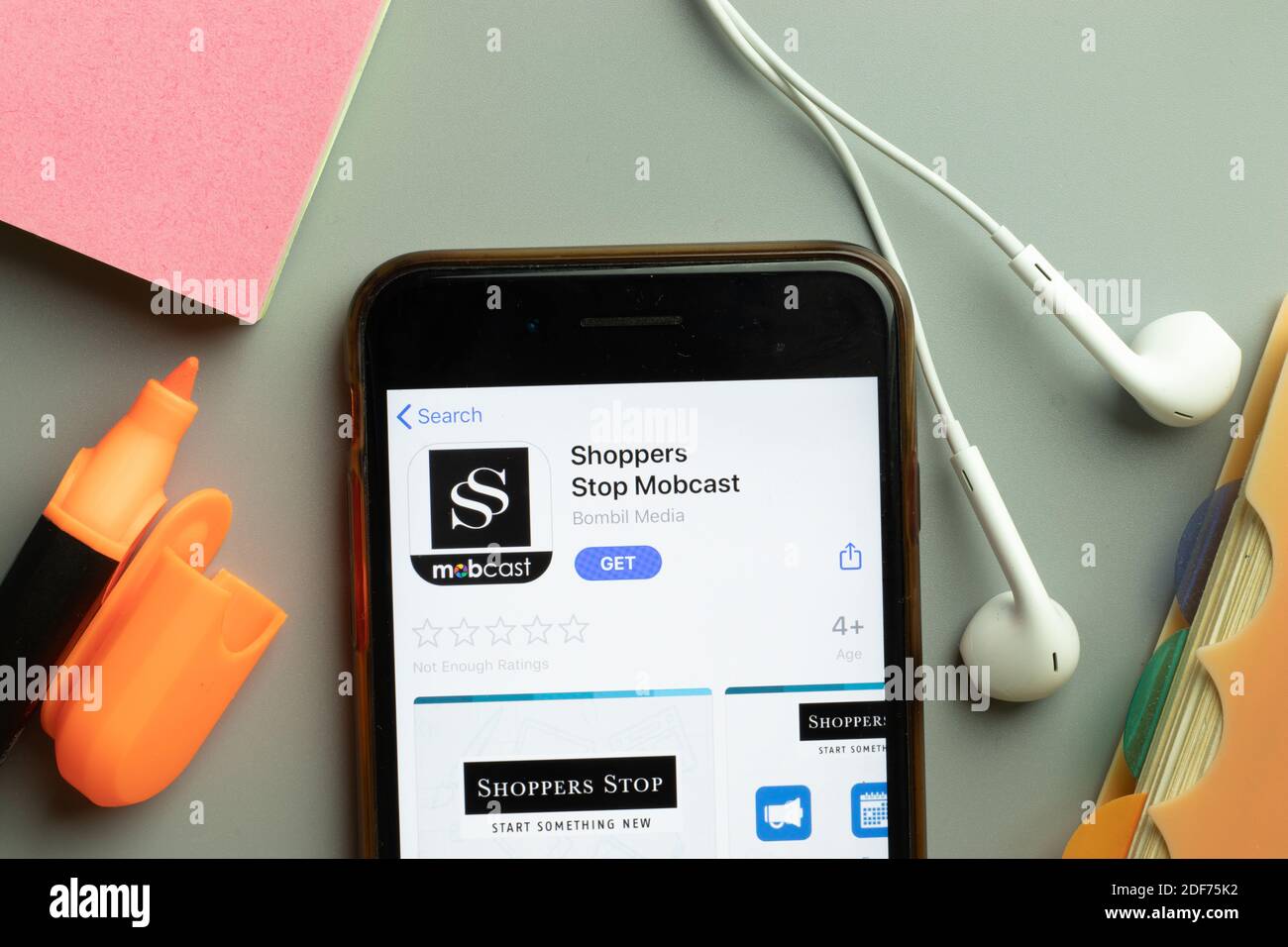 New York, USA - 1 December 2020: Shoppers Stop Mobcast mobile app icon on phone screen top view, Illustrative Editorial. Stock Photo