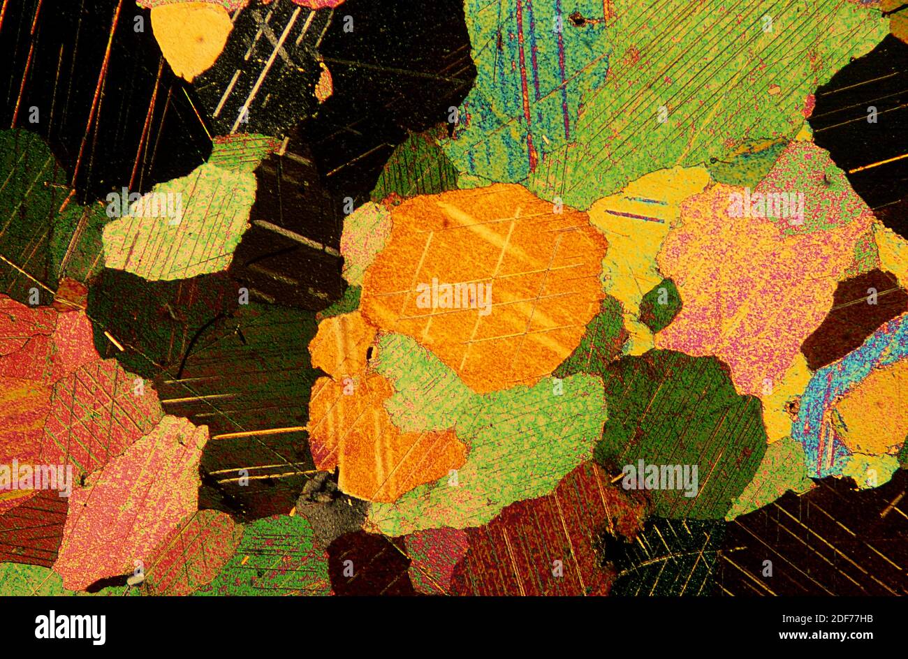 Marble is a metamorphic rock composed by calcium carbonate. Photomicrograph, thin section, polarized light. Stock Photo