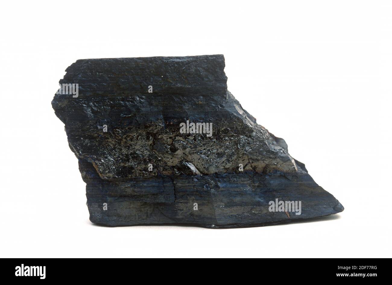Jet is a variety of lignite very dense and compact used as a gemstone. Sample. Stock Photo