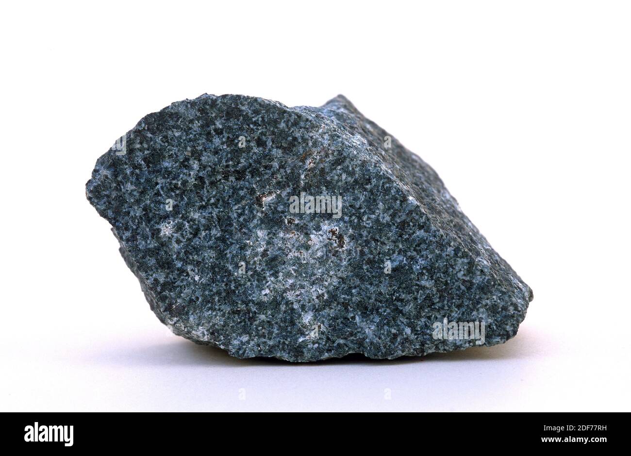 Diorite is an intrusive igneous rock. Its composition is intermediate between gabbro and granite. Sample. Stock Photo