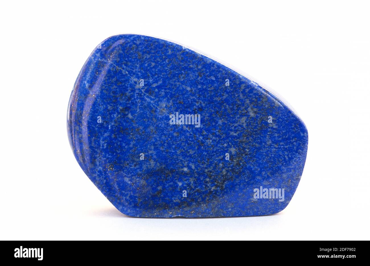 Lapis lazuli is a metamorphic rock composed mainly for lazurite. Is considerated a semiprecious stone. Polished sample. Stock Photo