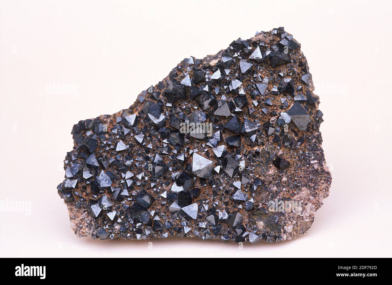Magnetite is an iron oxide mineral with magnetic properties. Crystallized sample. Stock Photo
