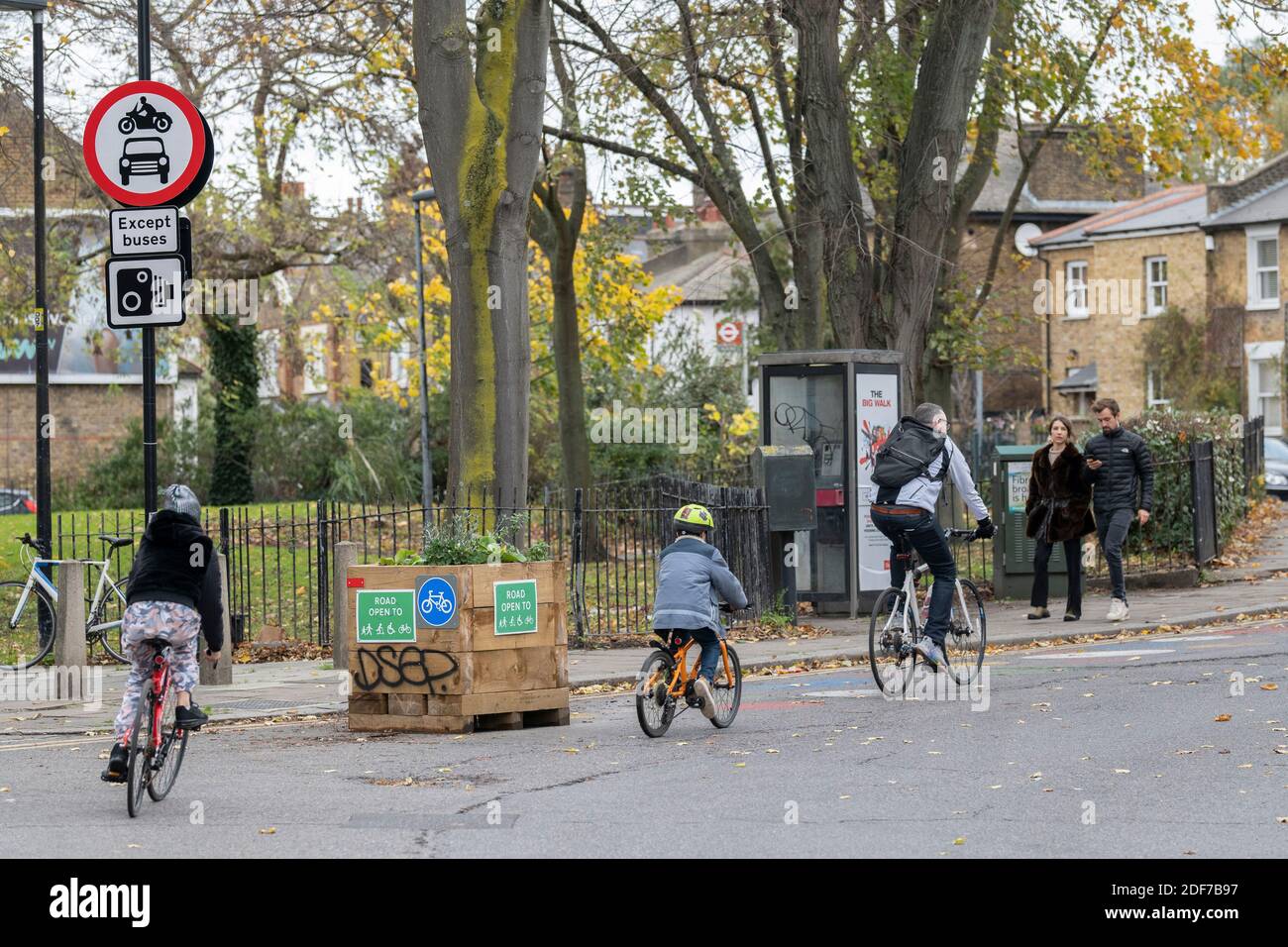 A family cycling on Railton Road in Brixton,London in the United