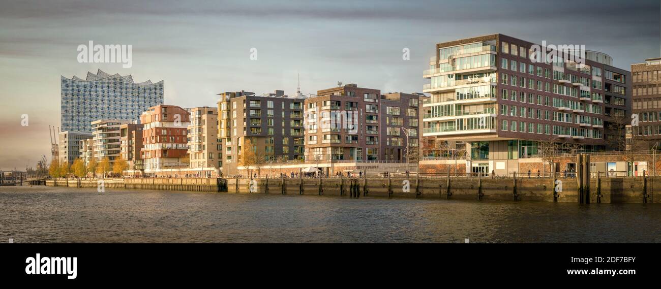 Panorama of the Hafencity in Hamburg at sunset with the Elbphilharmonie Stock Photo