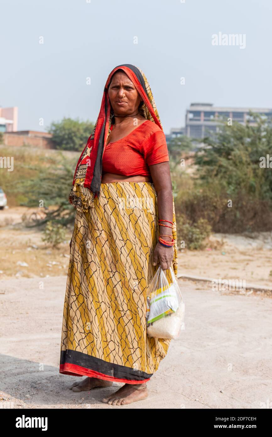 NOIDA, UTTAR PRADESH, INDIA - NOVEMBER 2020 : Portrait of Indian women from  village area in colorful dress standing outside their home Stock Photo -  Alamy