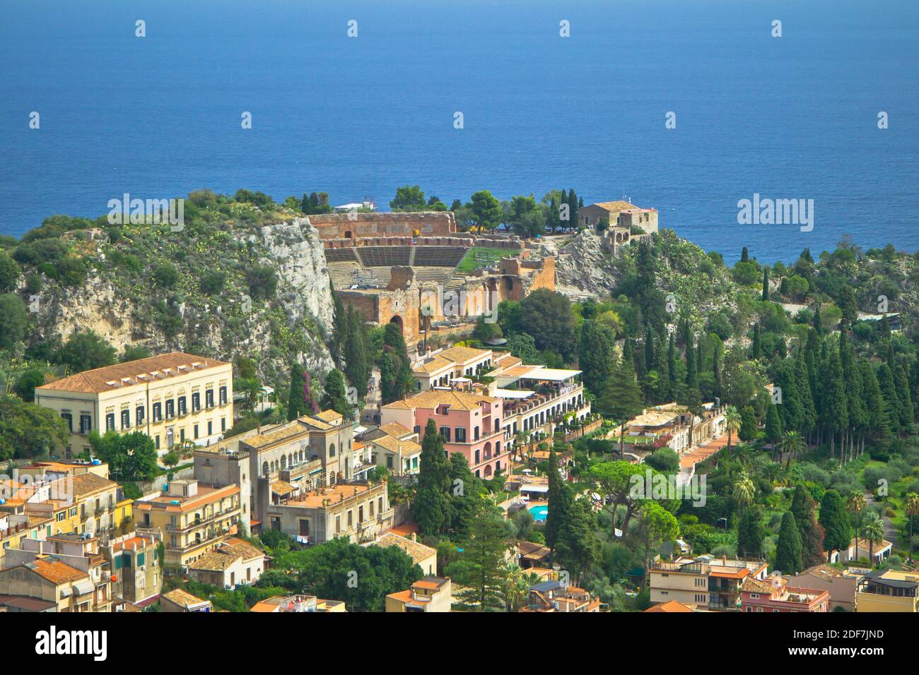 Taormina is a hilltop town on the east coast of Sicily. It sits near Mount Etna, an active volcano with trails leading to the summit. Stock Photo