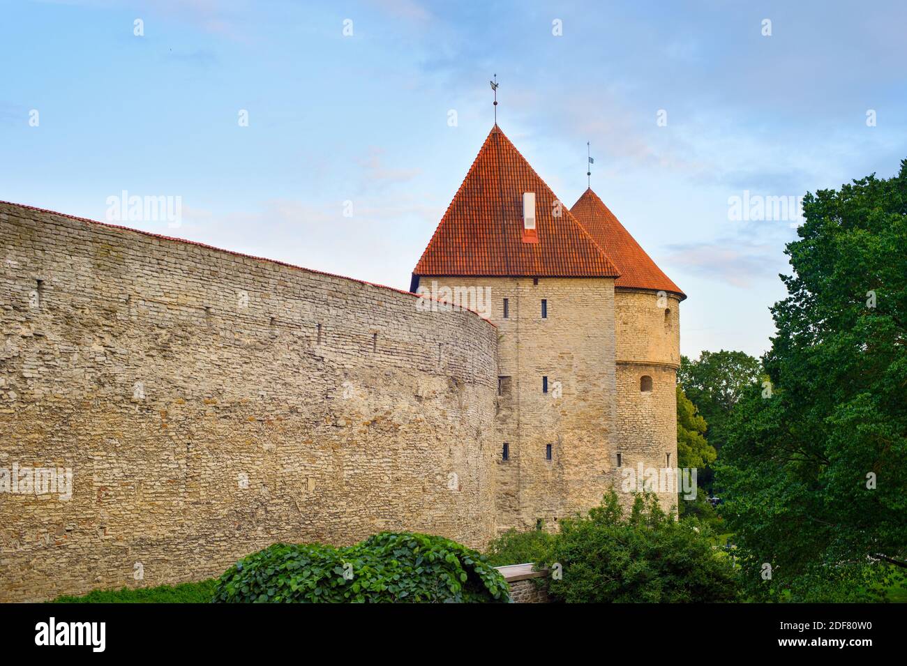 Fortress wall and towers of an Old Town of Tallin in sunset light. Estonia Stock Photo
