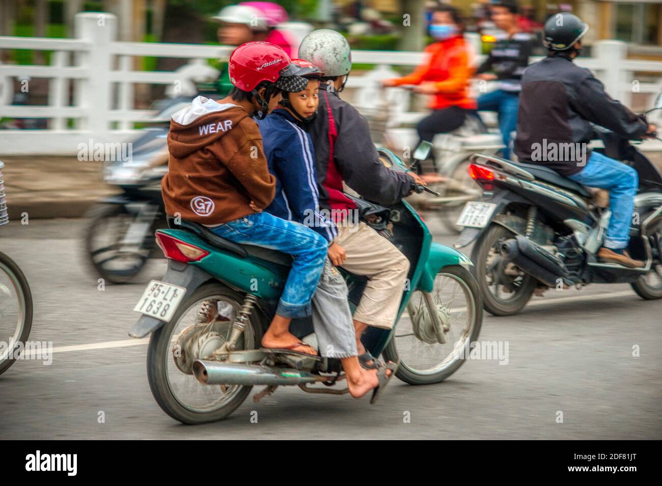 Three on a motor scooter, Hue, Vietnam Stock Photo - Alamy