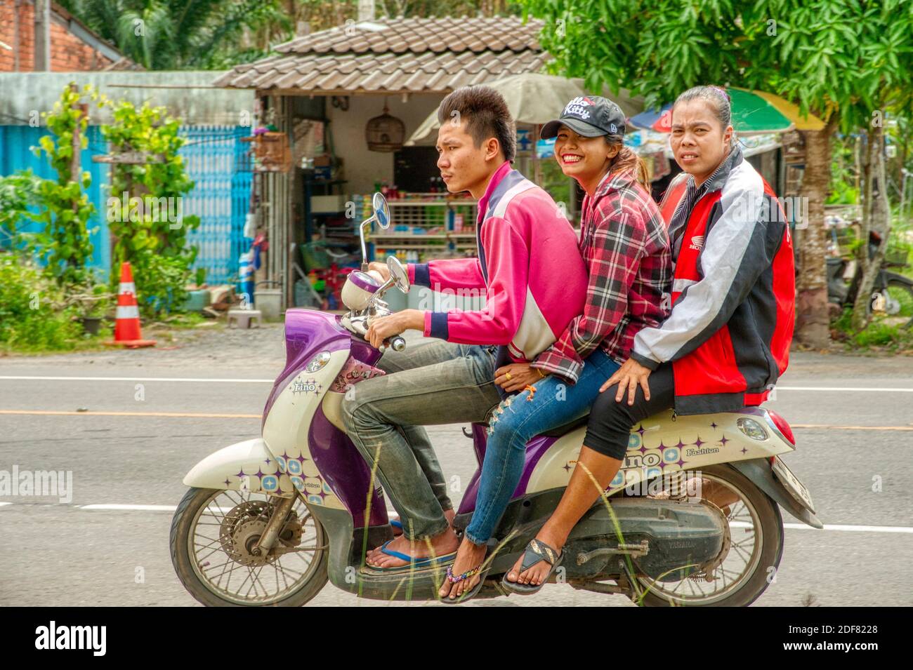 three on a motor scooter, Satun Province, Thailand. Stock Photo