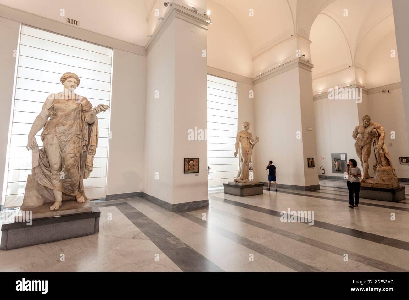 At left Flora Farnese, at right Farnese Hercules, marble statue, ancient roman sculptures