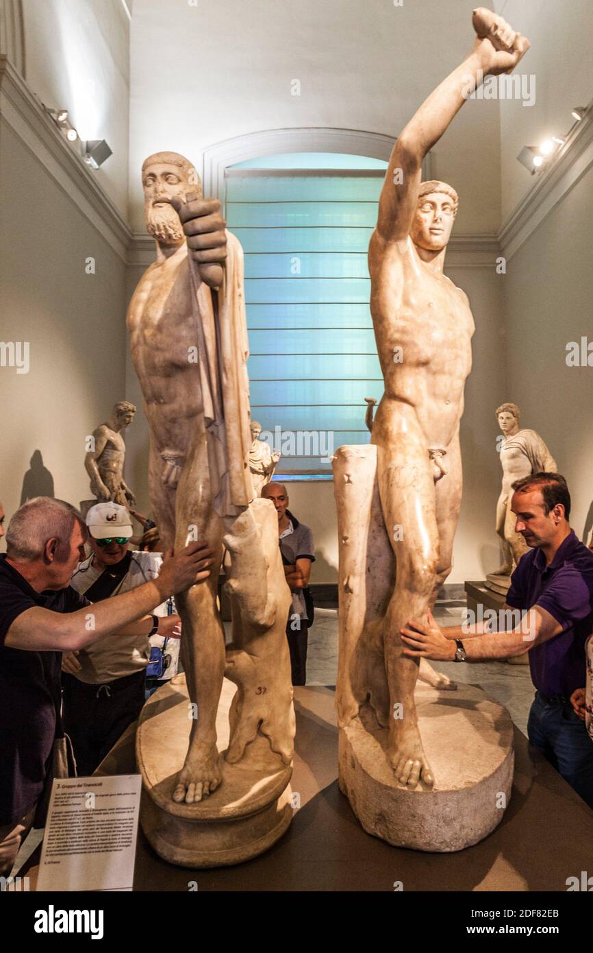 Group of blind people feeling the sculptures, Sculptural pairing of the tyrannicides Harmodius and Aristogeiton, Ancient Greek, Roman copies of the Stock Photo