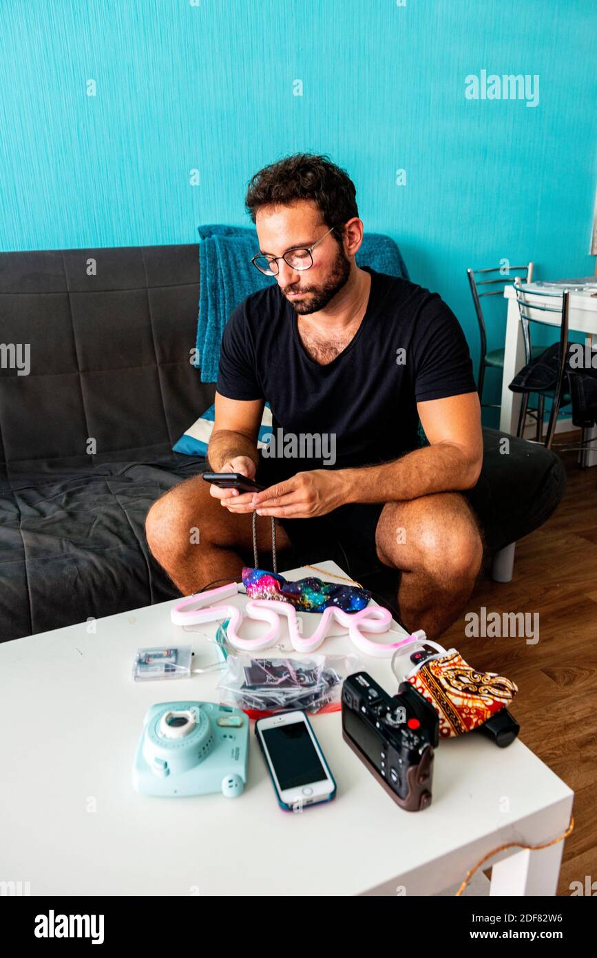 Berlin, Mature gay male frequently communicating using smartphone apps to kill time due Corona Crisis Lock and Quarantaine Photo - Alamy