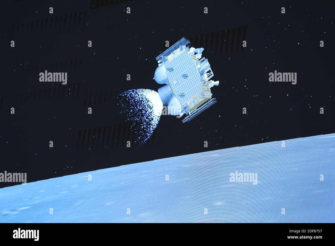 Beijing, China. 3rd Dec, 2020. Photo taken at Beijing Aerospace Control Center (BACC) in Beijing on Dec. 3, 2020 shows the ascender of Chang'e-5 spacecraft flying above the lunar surface. The Chinese spacecraft carrying the country's first lunar samples blasted off from the moon late Thursday, the China National Space Administration announced. This represented the first-ever Chinese spacecraft to take off from an extraterrestrial body. Credit: Jin Liwang/Xinhua/Alamy Live News Credit: Xinhua/Alamy Live News Stock Photo