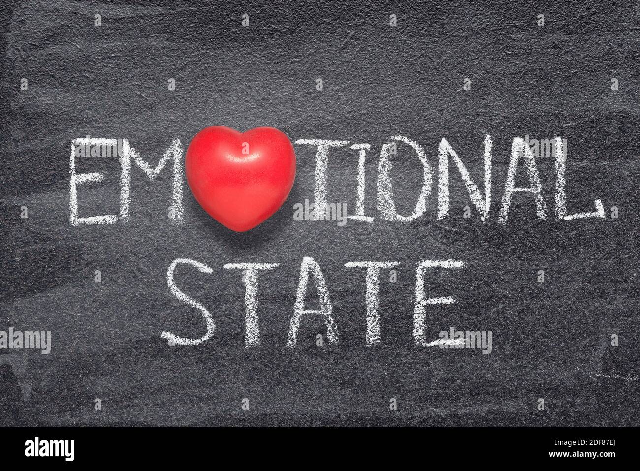 emotional state phrase handwritten on chalkboard with red heart symbol instead of O Stock Photo