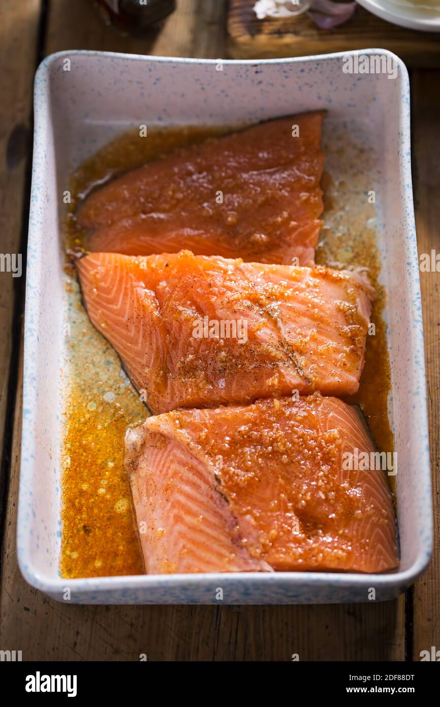 Baked salmon fish in marinate (garlic, paprika, maple syrup Stock Photo