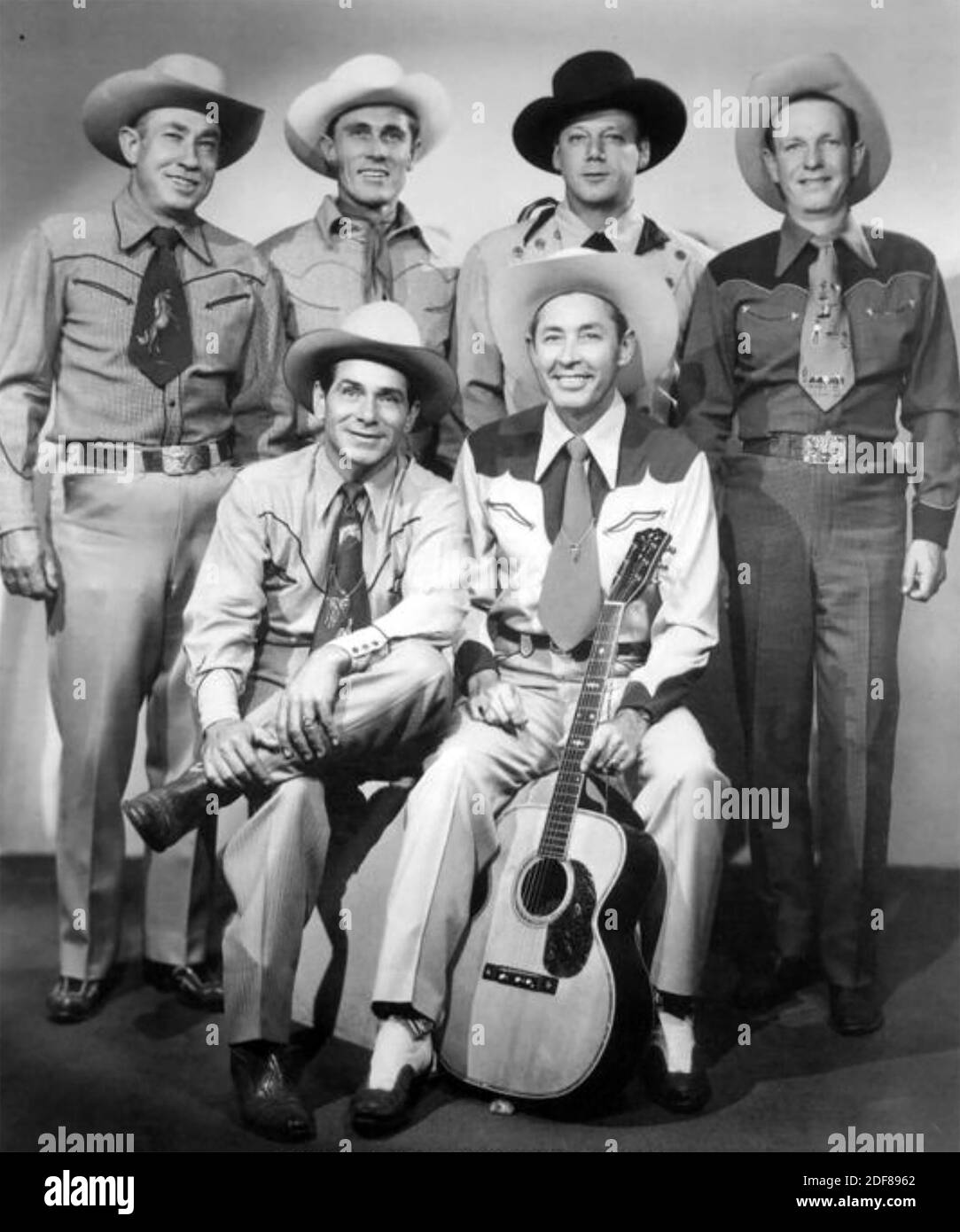 BOB NOLAN and the SONS OF THE PIONEERS Promotional photo of American Country group with Nolan seated at right about 1949 Stock Photo